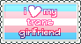 A stamp graphic with the trans flag in the background and the text 'i love(shown with a heart) my trans girlfriend'